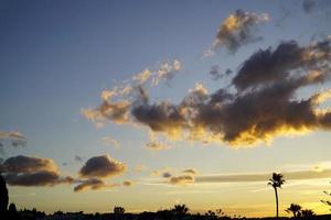 Dramatic Sky with Orange Clouds at Sunset photo