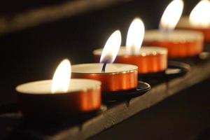 Burning Small Candles - Selective Focus - Religion Concept photo