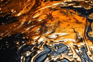 Metallic paint in a water surface background texture created with technology. photo