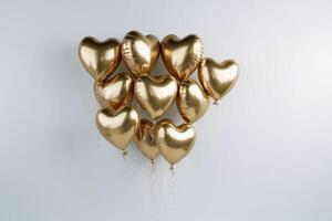 Festive golden balloons in heart shape on a light background created with technology. photo