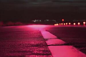 Road in pink neon colors. . photo