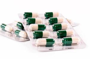 Green pills isolated photo