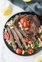 Beef stake with the beans photo