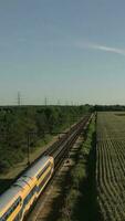 Aerial view of train traveling toward horizon video