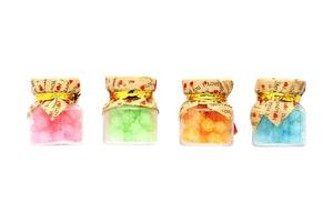 Colorful candy bottles on white background photo