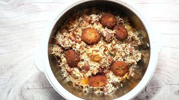 Lamb biryani meal in a bowl on table video