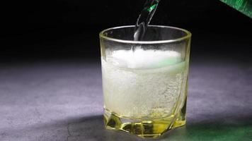 pouring sparkling water in a glass on table video