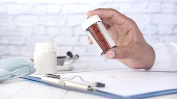 Close up of doctor hand holding pill container video