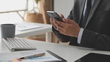 Financial analysts analyze business financial reports on a digital tablet planning investment project during a discussion at a meeting of corporate showing the results of their successful teamwork. video