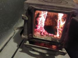 Firewood burning in the oven photo