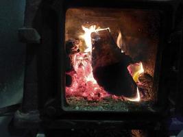 Firewood burning in the oven photo