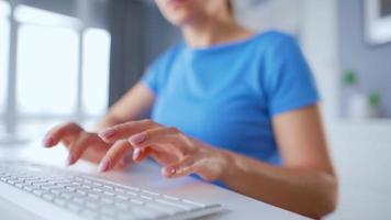 Female hands typing on a computer keyboard. Concept of remote work. Home Office video