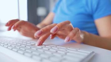 Female hands typing on a computer keyboard. Concept of remote work. Home Office video