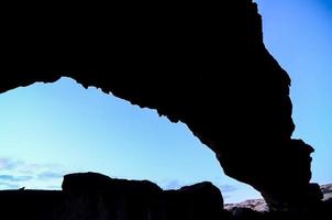 Silhouette of a rock formation photo