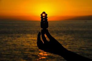 Hand holding a lightbulb photo