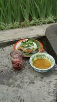 curry and Thai style lunch on the wooden table photo