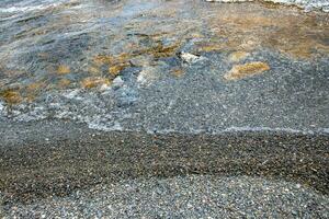 Close up water with stones background concept photo. Pebbles under water. The view from the top, nautical background. High quality picture for wallpaper photo