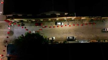 Aerial view worker hang row of Chinese New Year red lantern video