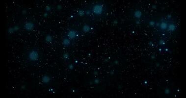 Natural organic dust particles floating on black background. Dynamic dust particles floating in space randomly in slow motion. video