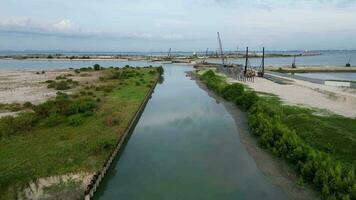 Aerial move over clear canal at reclamation Andaman Island video