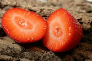 Fresh strawberry half slice in close up view. Macro photo