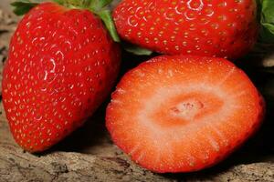 Fresh strawberry half slice in close up view. Macro photo