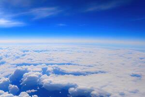 View of the sky above clouds over the earth deep blue sky with white clouds. photo