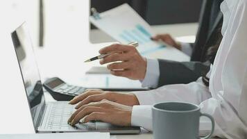 Financial analysts analyze business financial reports on a digital tablet planning investment project during a discussion at a meeting of corporate showing the results of their successful teamwork. video