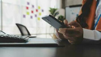 Financial analysts analyze business financial reports on a digital tablet planning investment project during a discussion at a meeting of corporate showing the results of their successful teamwork. video
