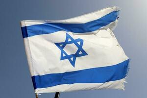 The blue and white flag of Israel with the six-pointed Star of David. photo