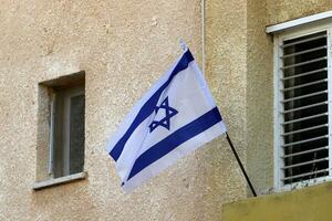 The blue and white flag of Israel with the six-pointed Star of David. photo