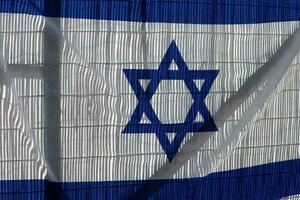 The blue and white flag of Israel with the six-pointed Star of David. photo