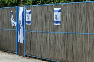 The blue and white flag of Israel with the six-pointed Star of David. photo