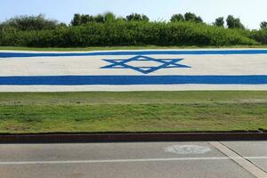 The blue and white flag of Israel with the six-pointed Star of David. photo