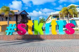 Entrance to Basseterre shopping district and historic center with colorful colonial architecture photo