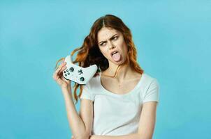 cheerful woman in a white t-shirt with a joystick in her hands video games entertainment photo