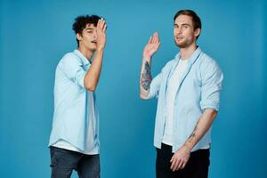 good friends in shirts on a blue background communication greeting party photo