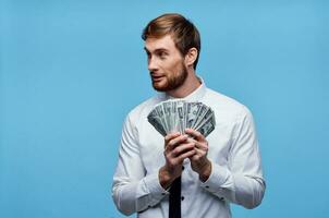 man with money in the hands of businessman emotions wealth photo