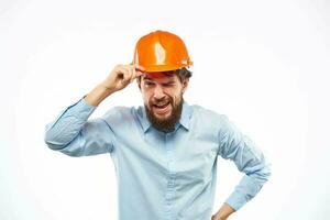 man in work uniform orange helmet professional safety industry construction photo