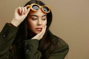 young woman jacket sunglasses elegant style fashion isolated background photo