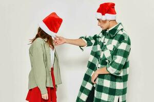 Man and woman New Year clothes emotion holiday Christmas Santa hat photo