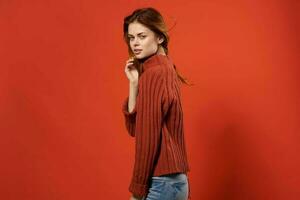 beautiful woman in red sweater fashion glamor studio photo