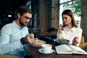 business man and woman sitting in a cafe snack communication lifestyle photo