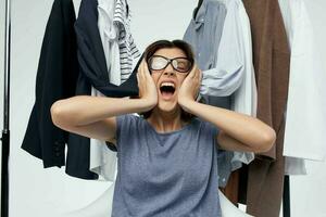 beautiful woman clothes hanger shopping studio emotion photo