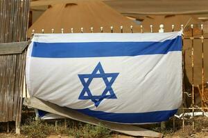 The blue and white flag of Israel with the six-pointed Star of David. photo