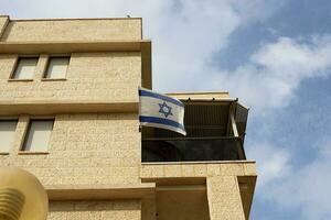 The blue and white flag of Israel with the six-pointed Star of David. photo