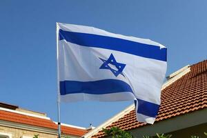 The blue and white flag of Israel with the six-pointed Star of David. photo