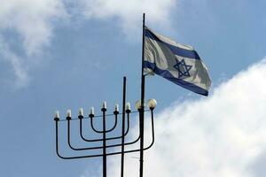 The blue and white flag of Israel with the six-pointed Star of David. photo