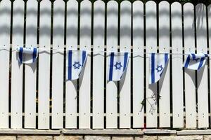 The blue and white flag of Israel with the six-pointed Star of David. photo