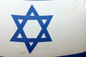 The blue and white flag of Israel with the six-pointed Star of David. photo